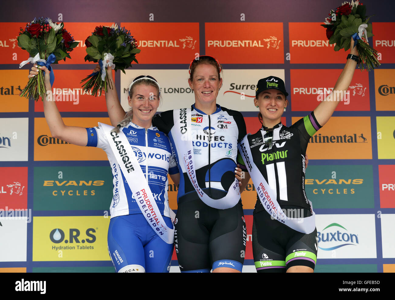 Kirsten Wild (centre) winner of the PRL Classique with runner up Nina Kessler (left) and 3rd place Leah Kirchmann (right) during day one of Prudential RideLondon. Stock Photo