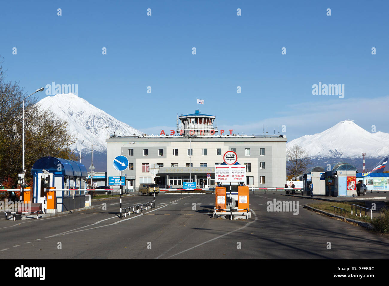 Commercial airport Petropavlovsk-Kamchatsky on background of Koryaksky Volcano and Avacha Volcano. Russia, Far East, Kamchatka. Stock Photo