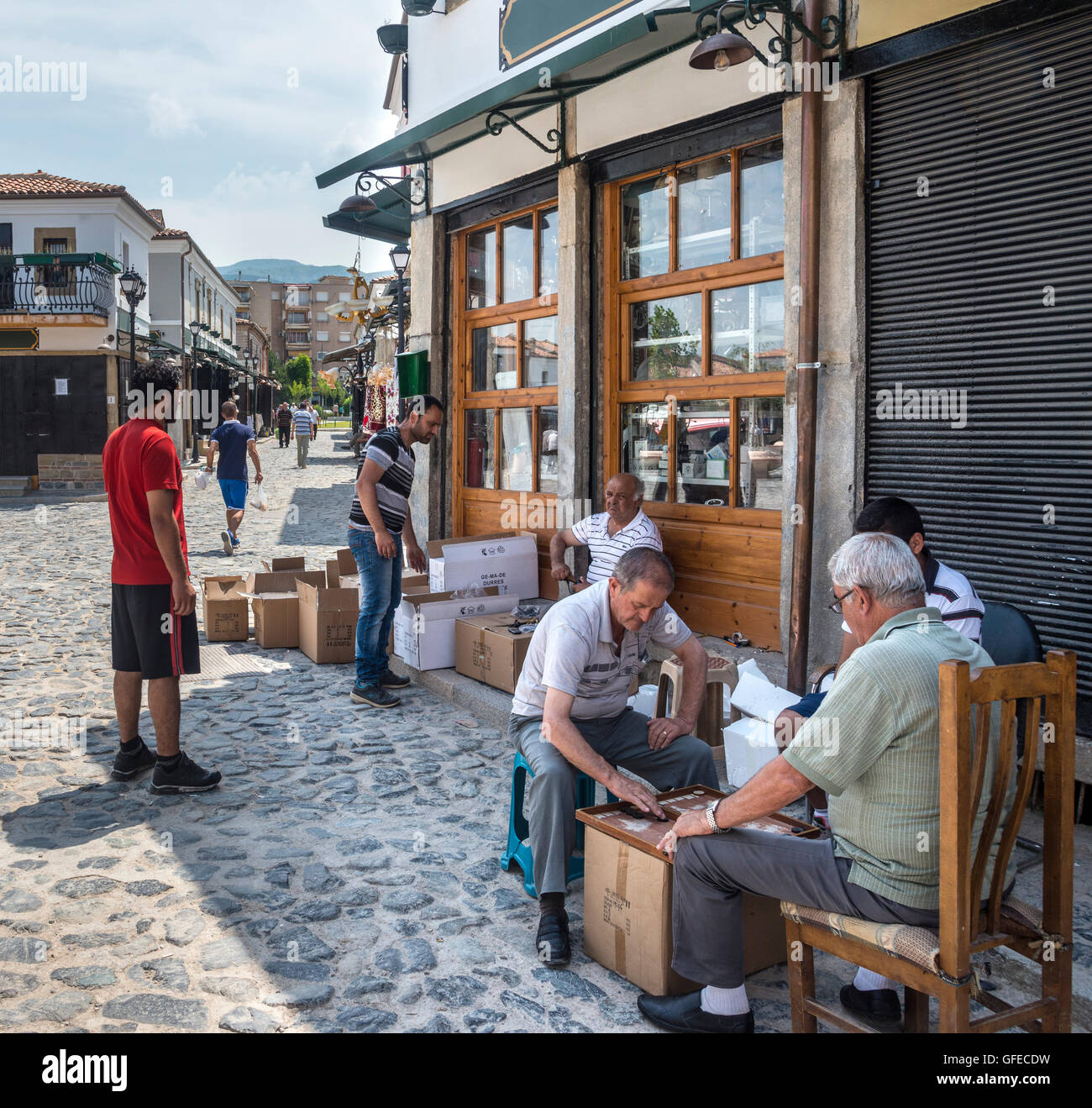 Playing backgammon in the bazaar district. Korca, South eastern Albania ...