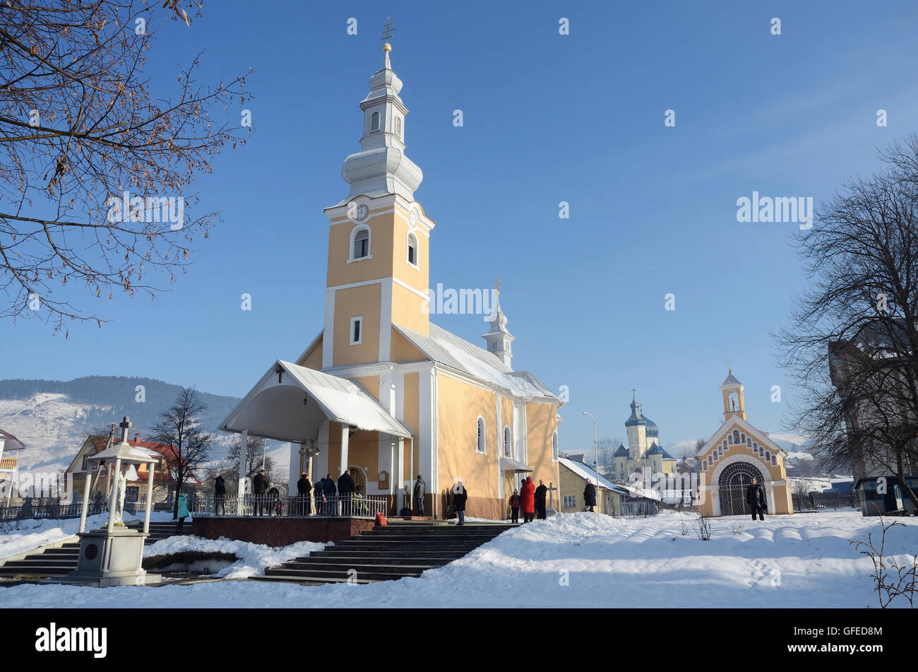 MIZHGIRYA,UKRAINE - JANUARY 14, 2014: Tourists visit Cathedral at daytime on january 14, 2014 in Mizhgirya,Ukraine. It is ancien Stock Photo