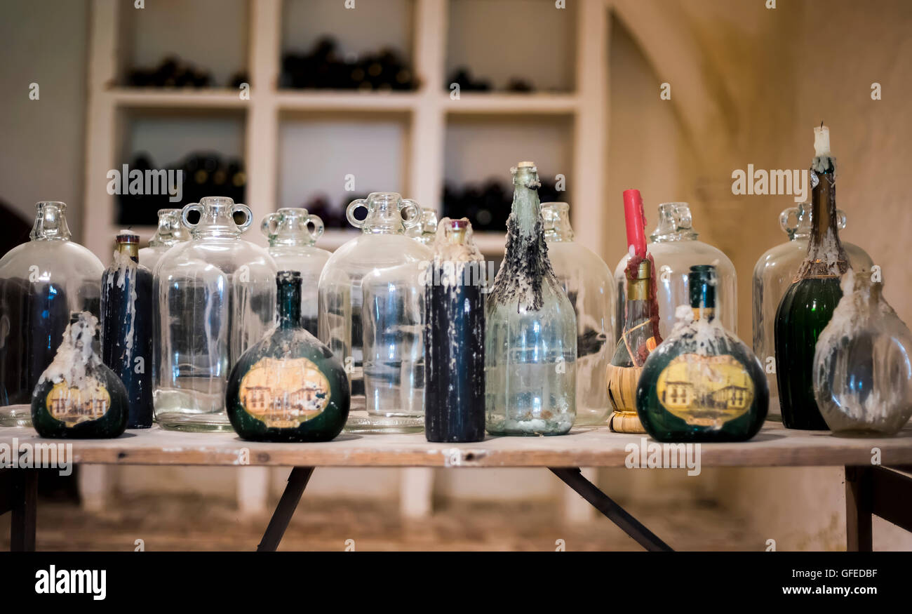 Collection of bottles and jars with candle wax Stock Photo
