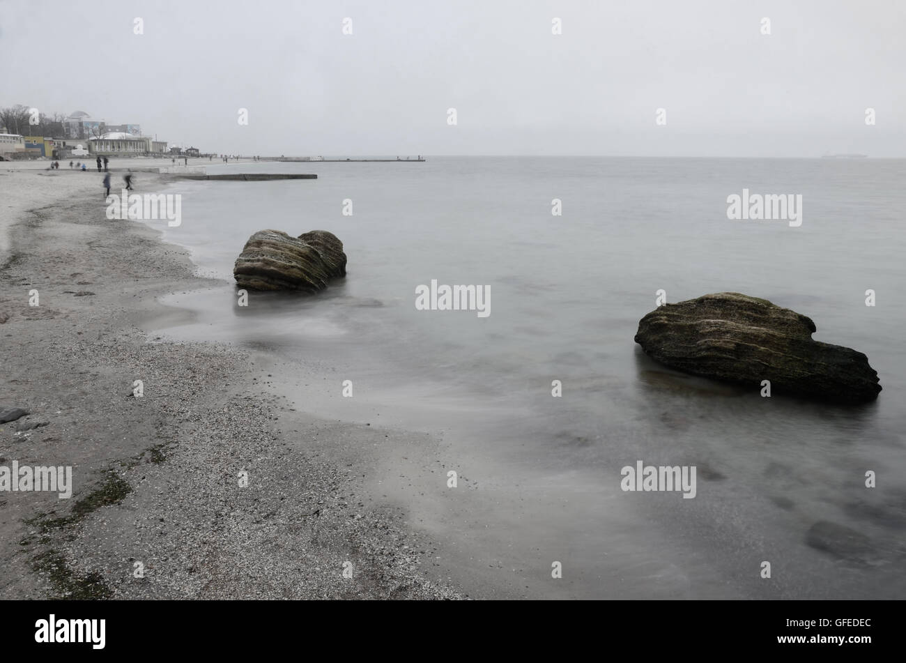 Public beach of Odessa Black Sea coast with limestone rock stones during winter time, South Ukraine Stock Photo