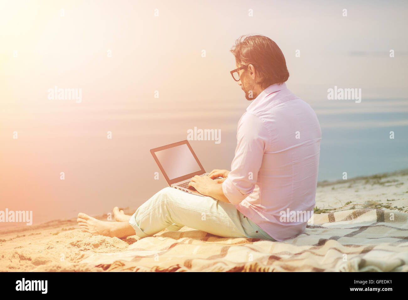 Writer with laptop Stock Photo - Alamy