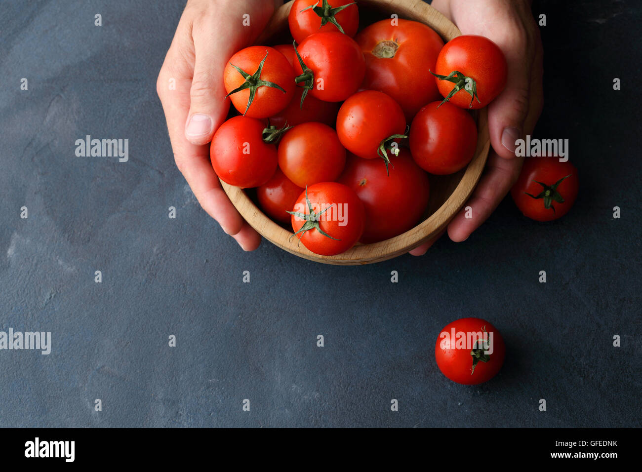 raw organic tomatoes in bowl, food top view Stock Photo - Alamy