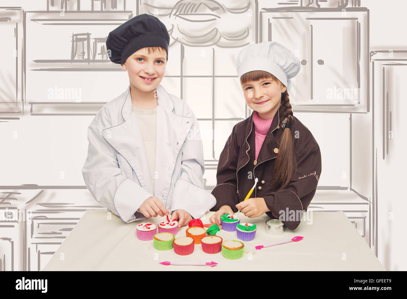 Beautiful Boy And Girl In Chef Clothes Making Christmas Cupcakes