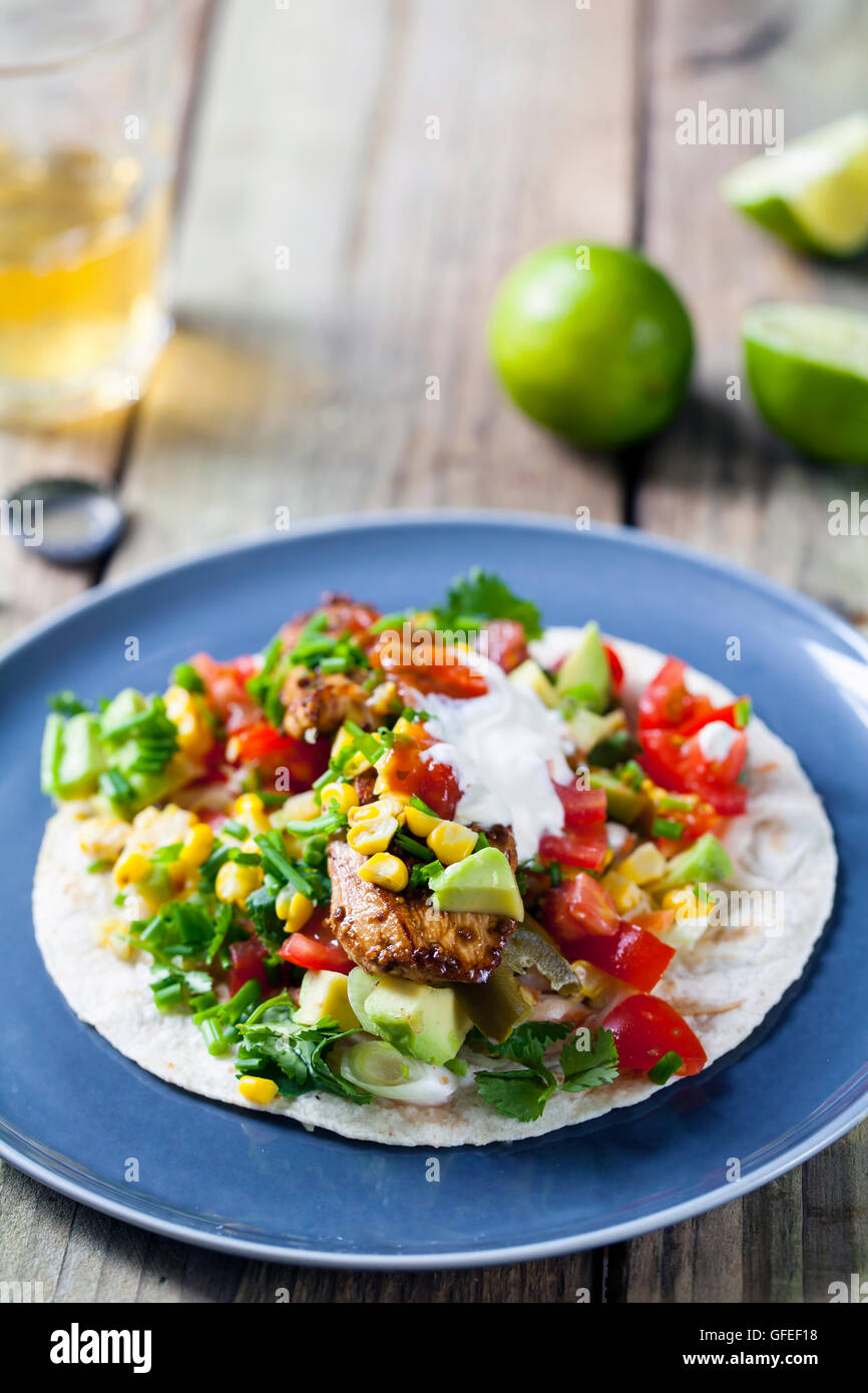Chicken tortilla with avocado, tomatoes, sweetcorn and salsa Stock Photo