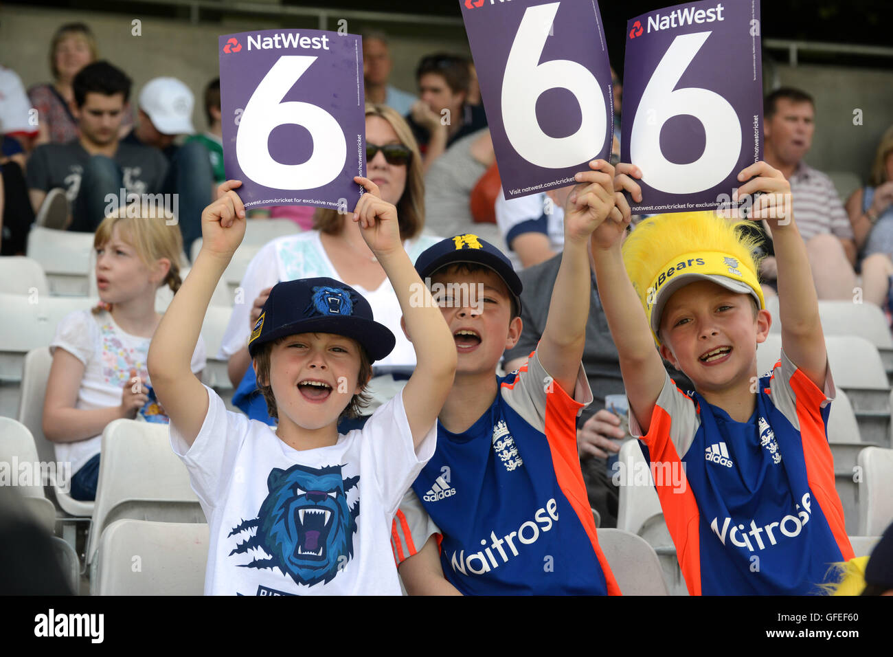 Young cricket Cricket fans spectators celebrating a six at Edbaston home of Warwickshire County Cricket Club Stock Photo