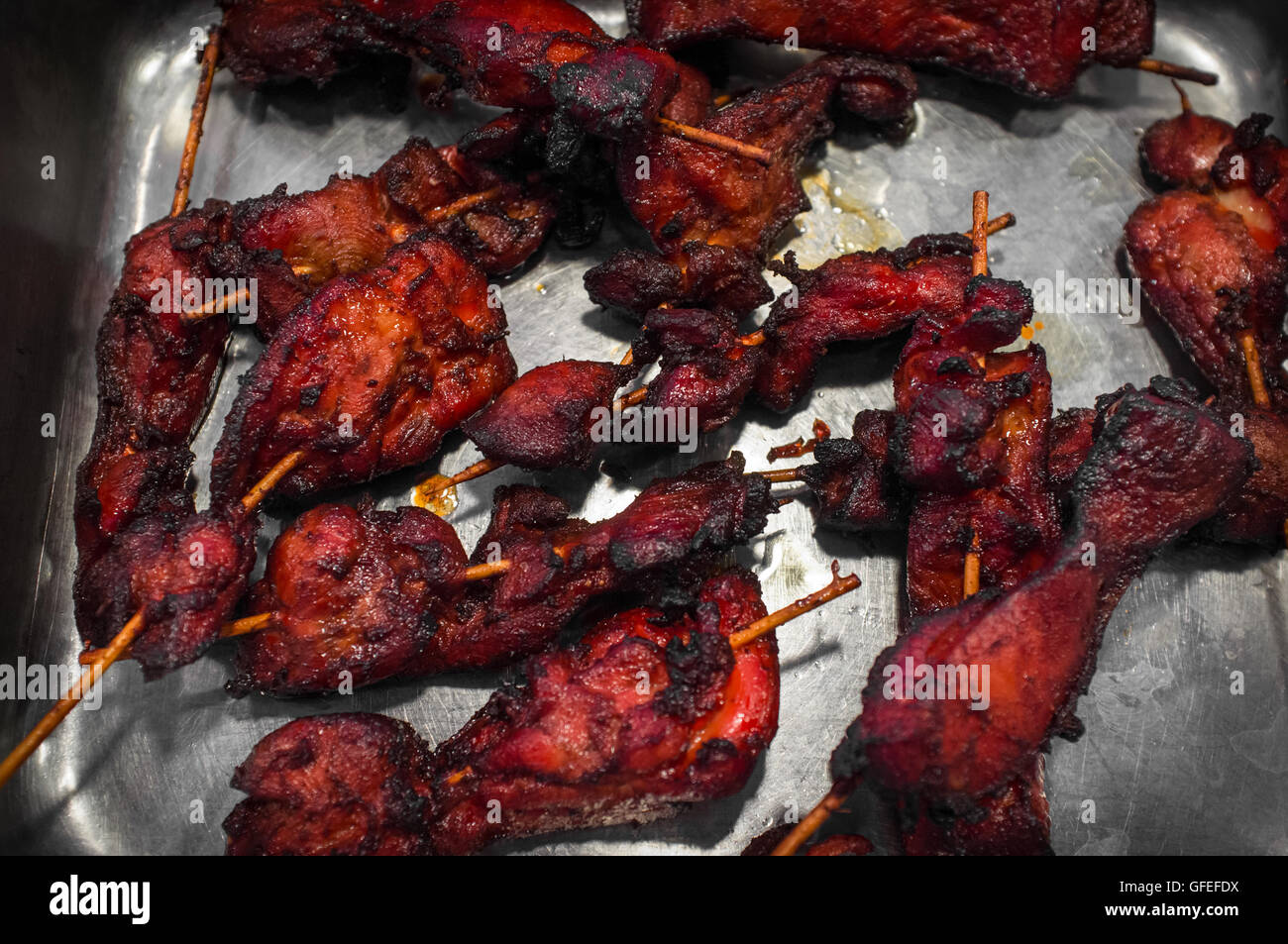 Restaurant style Chinese red chicken kebabs on serving tray Stock Photo -  Alamy
