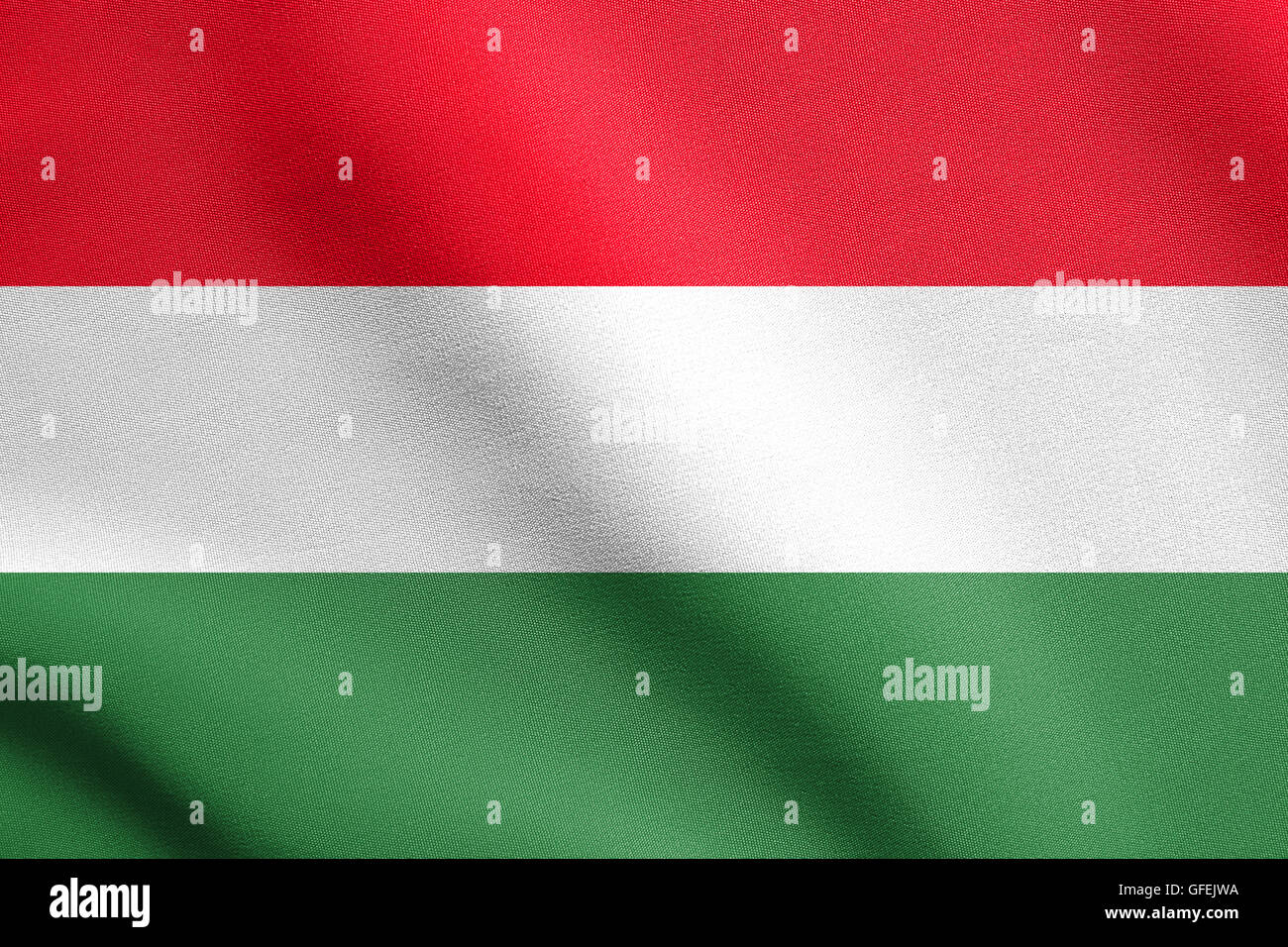 Flag of Hungary waving in the wind with detailed fabric texture. Hungarian national flag. Stock Photo