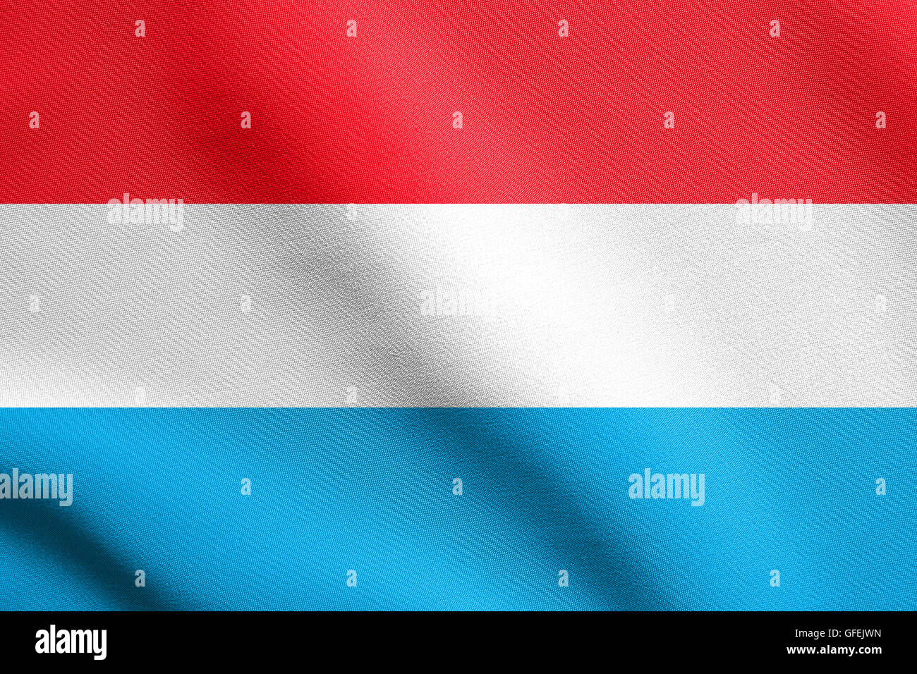 Flag of Luxembourg waving in the wind with detailed fabric texture. Luxembourgish national flag. Stock Photo