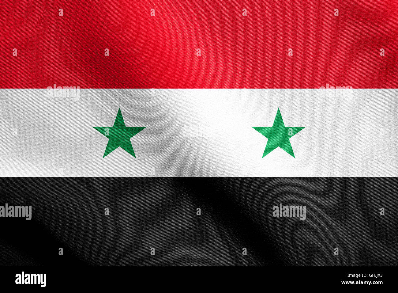 Flag of Syria waving in the wind with detailed fabric texture. Syrian national flag. Stock Photo