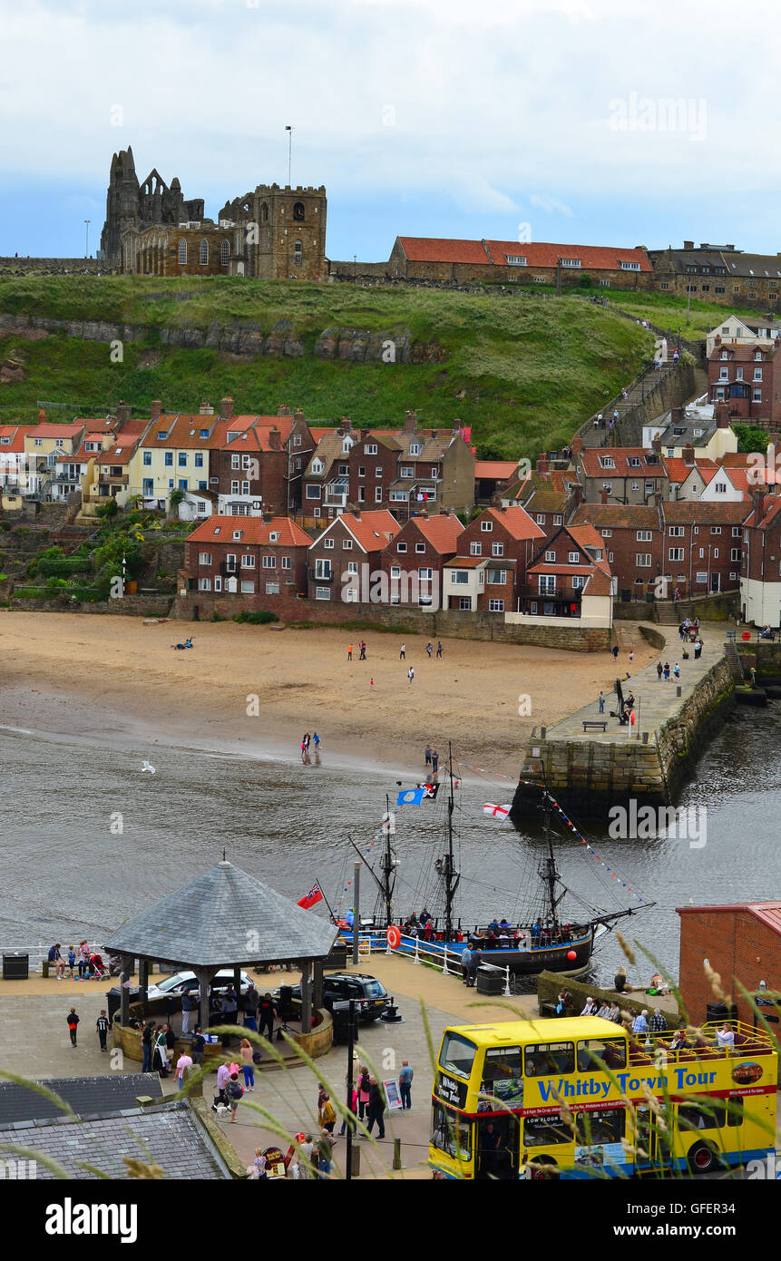 A view of Whitby Pier and harbour looking across rooftops in The North ...