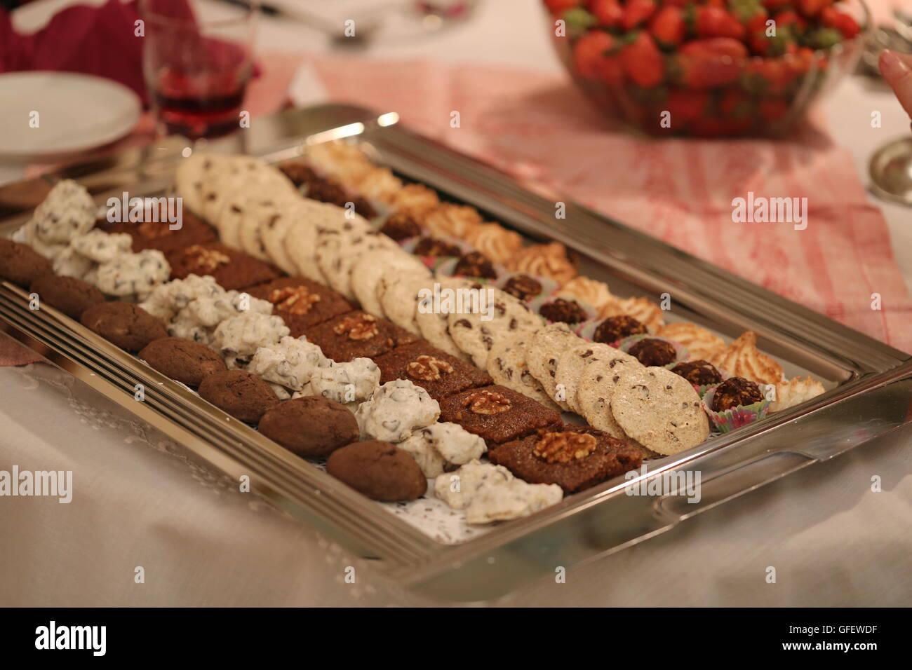 Cookies in a Silver Plate. Rectangle silver plate with variety of homemade cookies. Set of cookies in lines for the traditional Pesach festive meal. Stock Photo