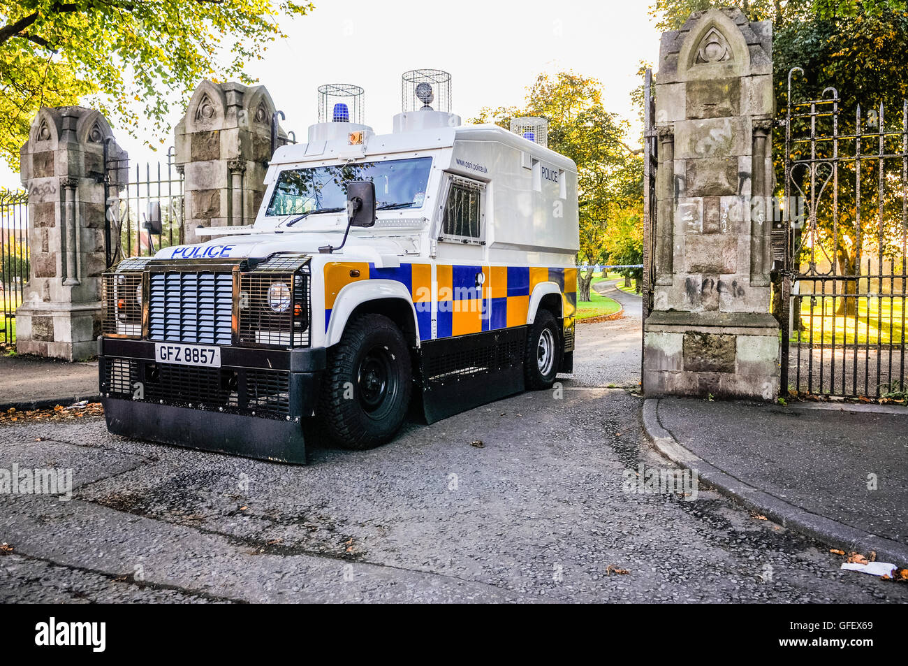 A PSNI police armoured Landrover guards the entrance of a park in Belfast. Stock Photo