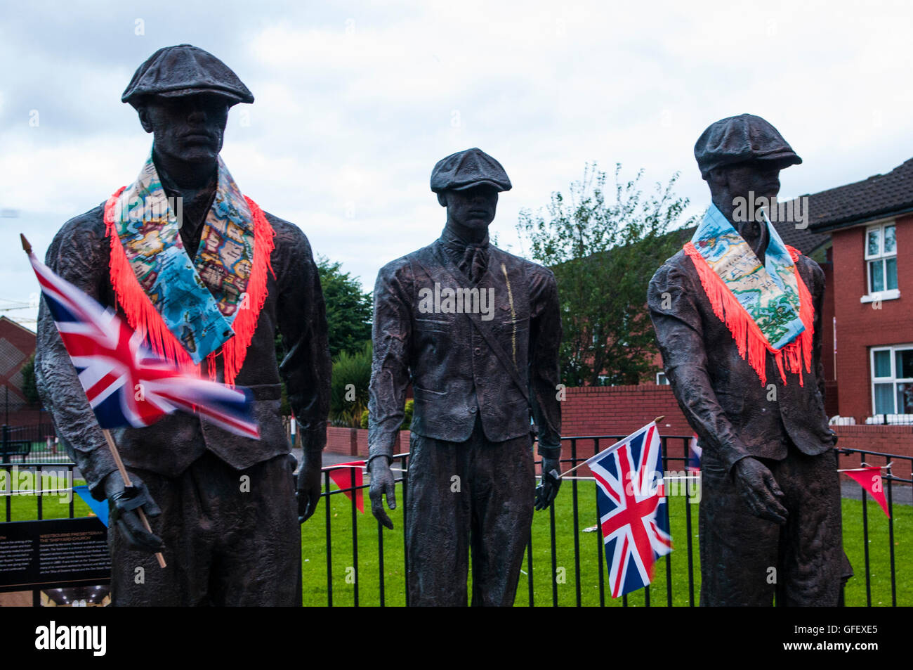 Belfast, Northern Ireland. 11 Jul 2016 - A public art display remembering the shipyard workers of Belfast is decorated with Orange "Sashes" or collarettes and Union Flags in readiness for the 12th July celebrations Stock Photo