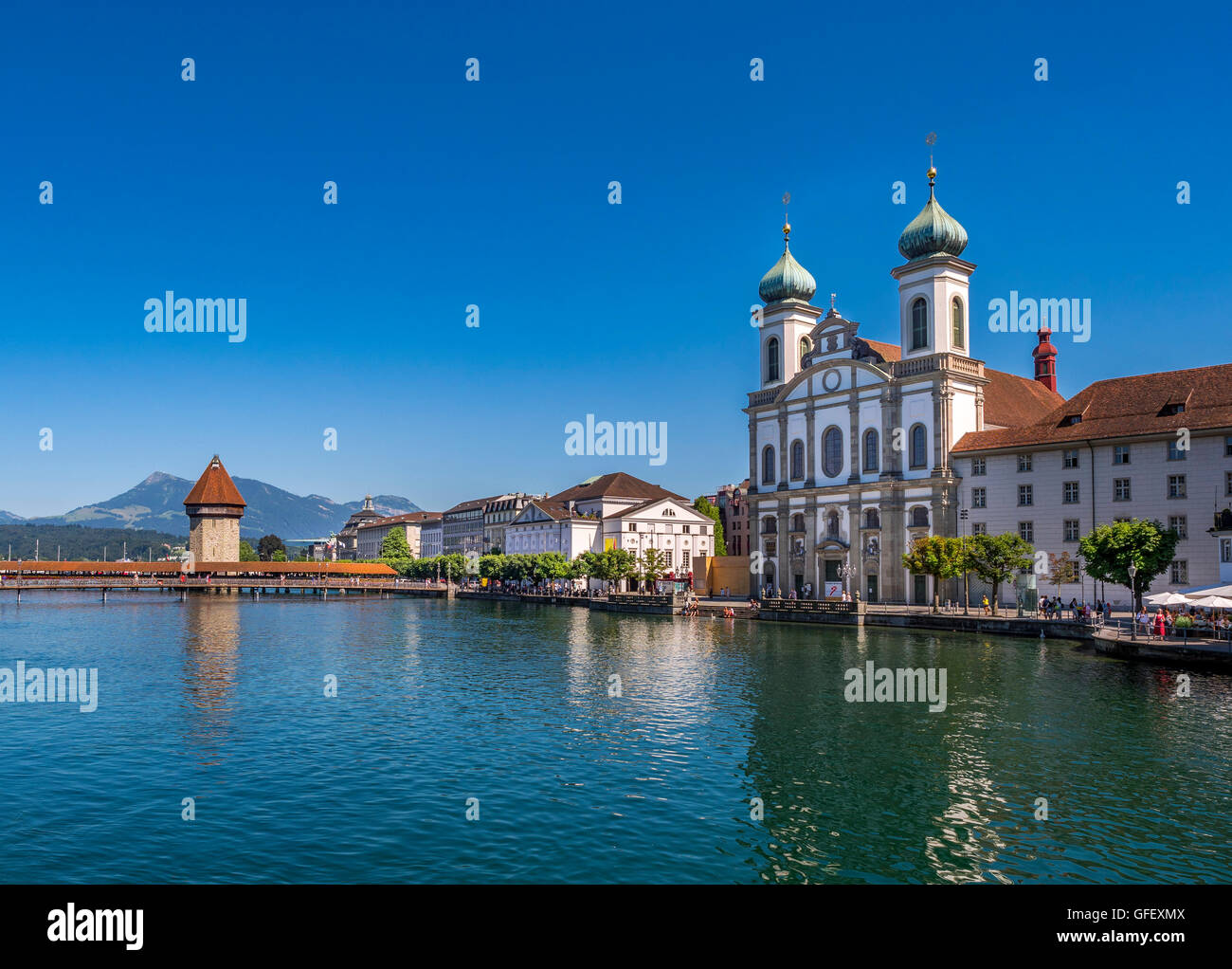 Jesuit Church and Chapel Bridge on the River Reuss in Lucerne, Switzerland, Europe Stock Photo