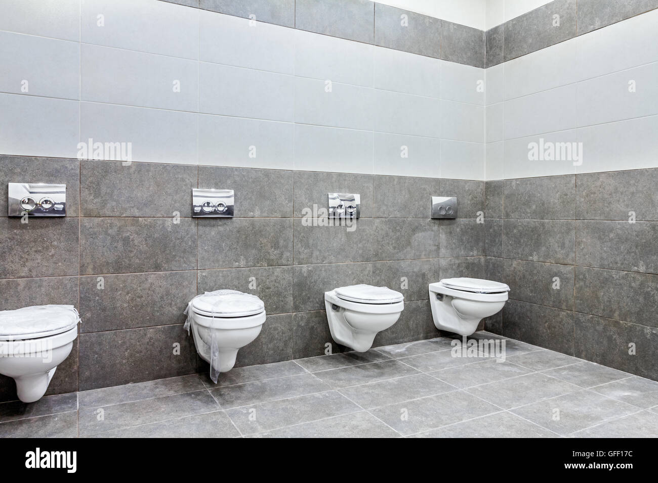 Designed public toilet bowls lined hires stock photography and images