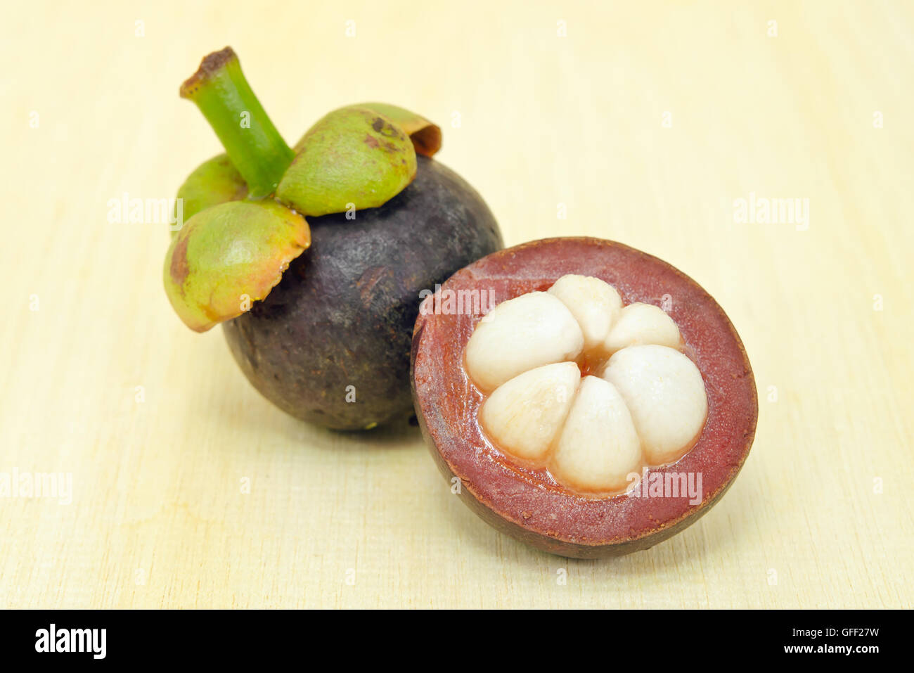 Mangosteen (Other names are garcinia, mangostana, clusiaceae, saptree, purple mangosteen, monkey fruit, Malpighiales) fruit with Stock Photo