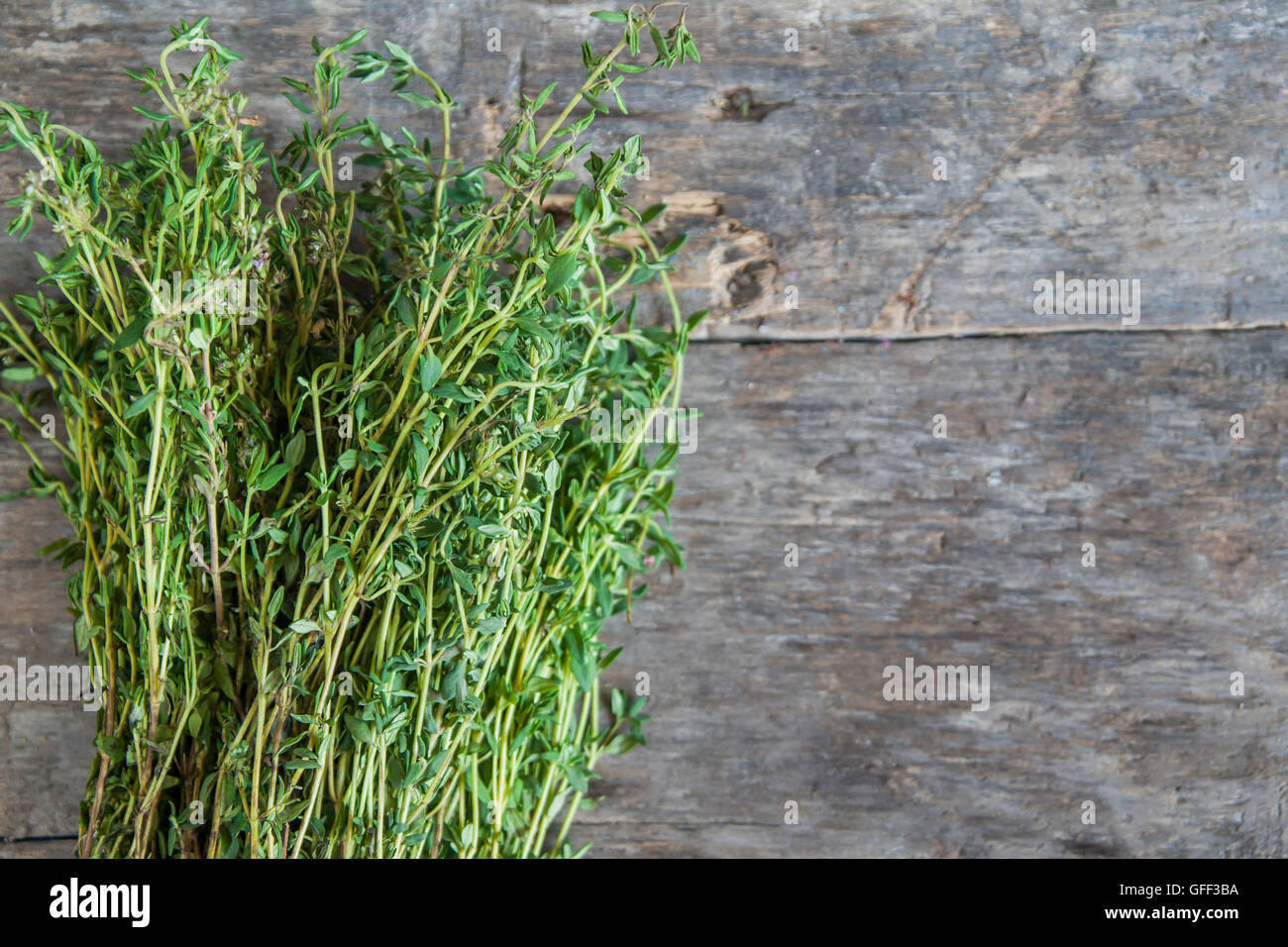 bunch of fresh estragon on a wooden table background Stock Photo - Alamy