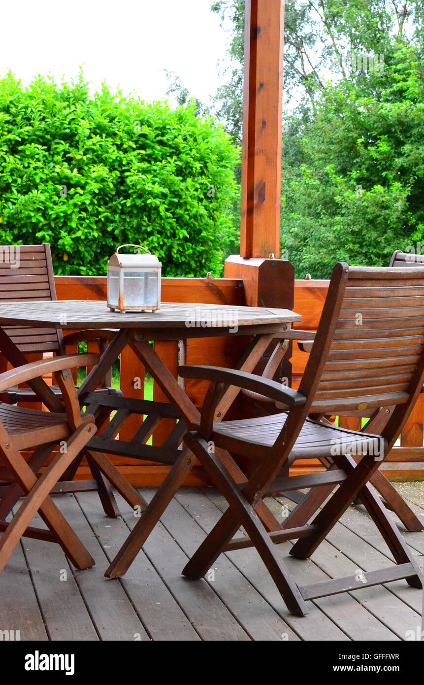 Wooden garden chairs and table on decking Stock Photo Alamy