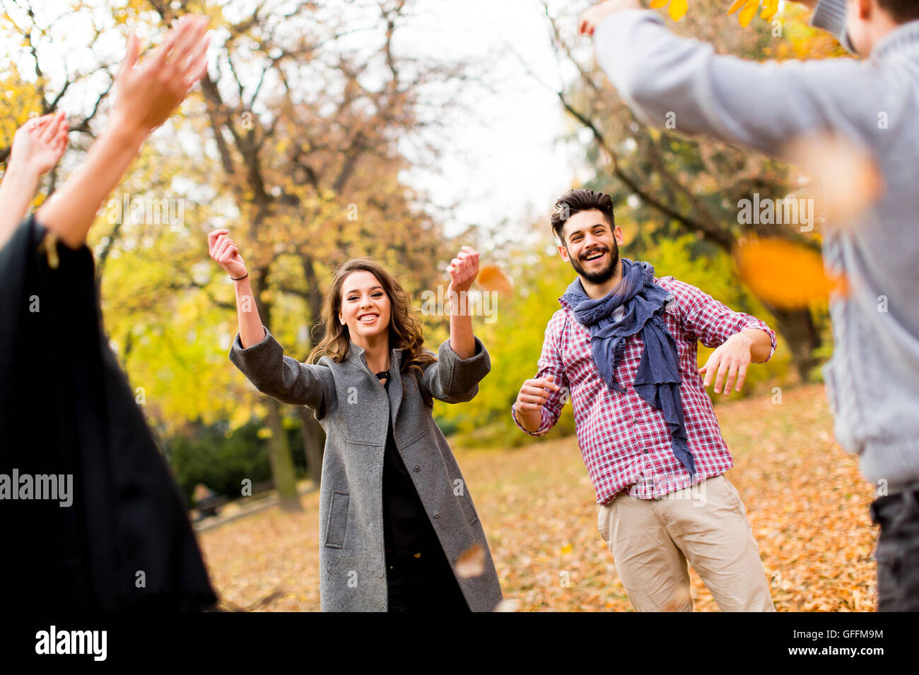 Young people having fun in the autumn park Stock Photo - Alamy