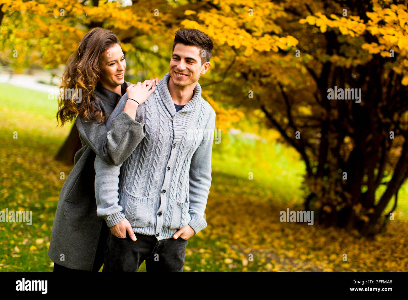 Loving young couple in the autumn park Stock Photo - Alamy