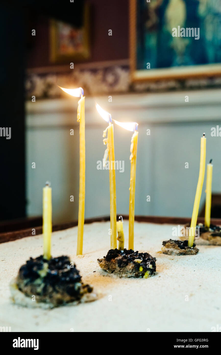lighting candles in a church church candles Stock Photo Alamy