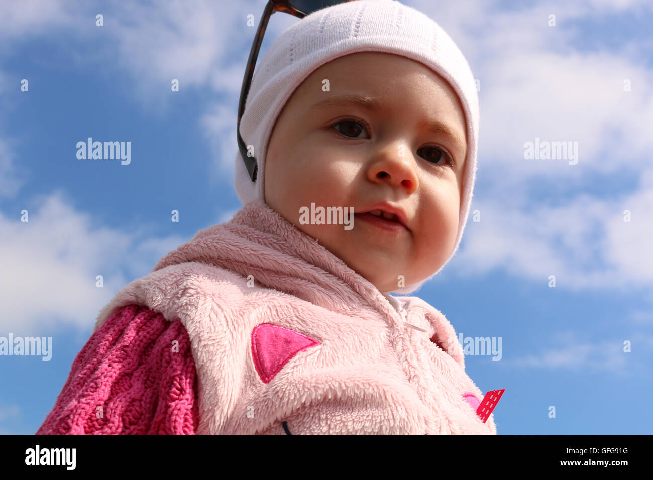 Outdoor portrait young child on a background of blue sky Stock Photo ...