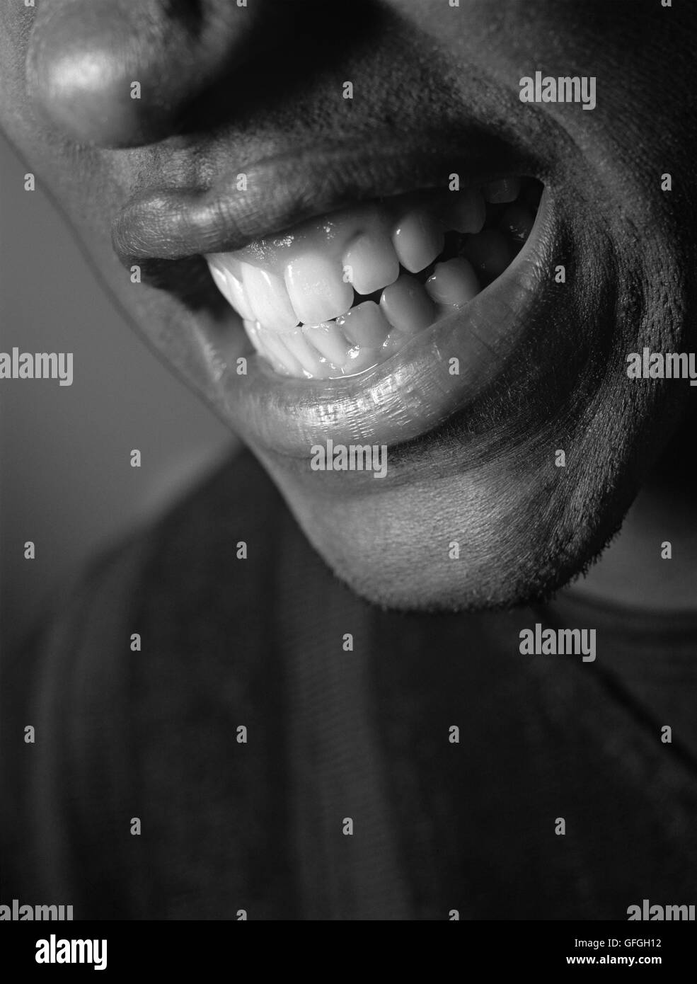Closeup of a man cringing his teeth in disgust Stock Photo