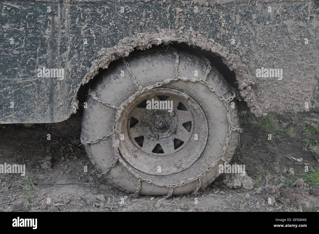 Muddy Tire with chains Stock Photo Alamy