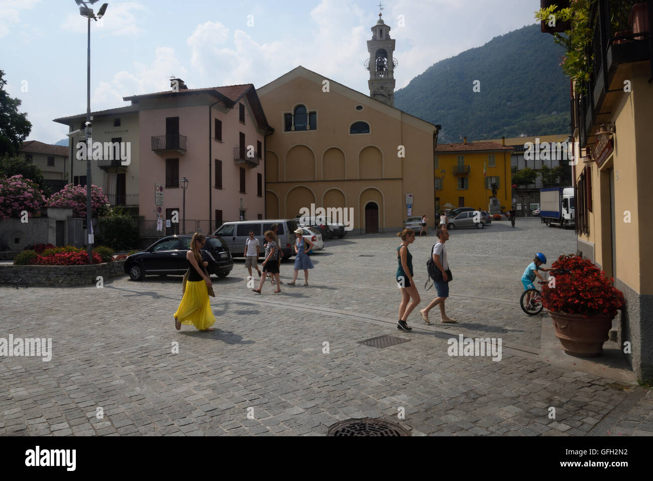 Lenno village square on lake Como with mountains in the background Stock Photo