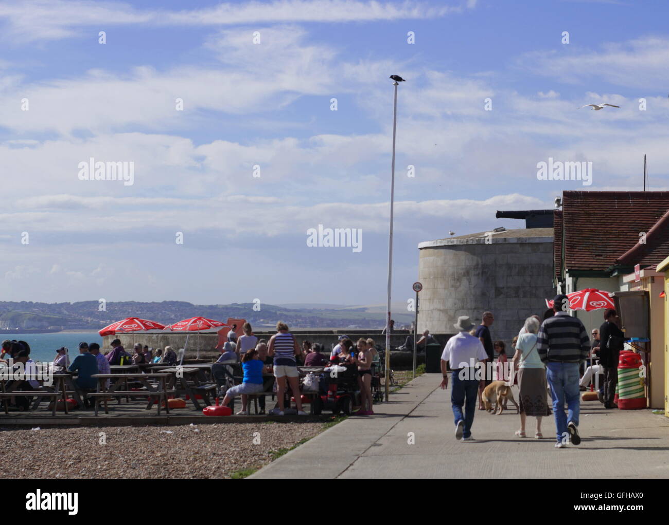 Martello tower and refreshment kiosk along Seaford seafront Stock Photo