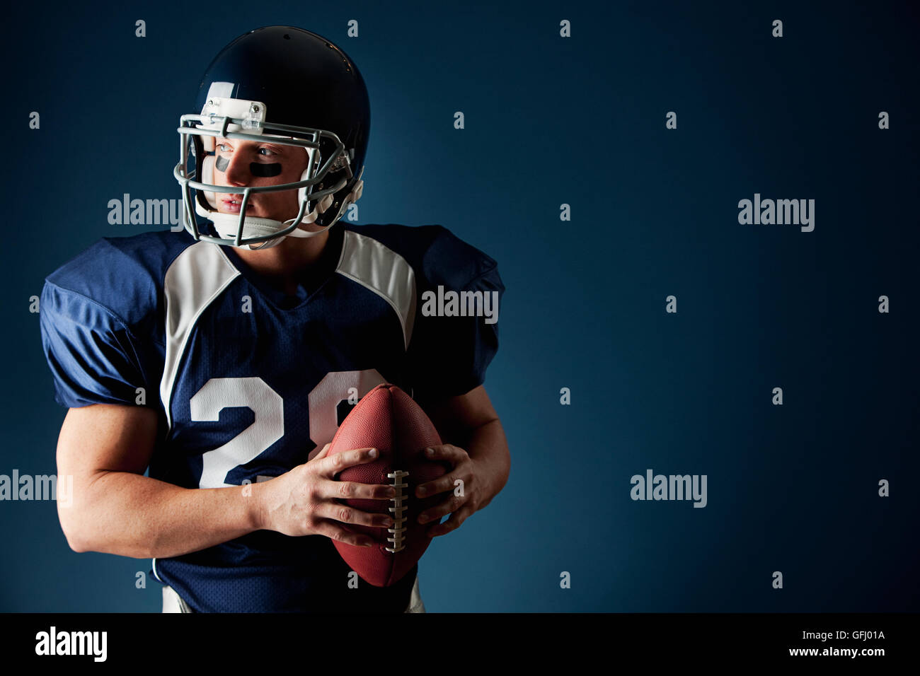 Football player blue uniform hi-res stock photography and images - Alamy
