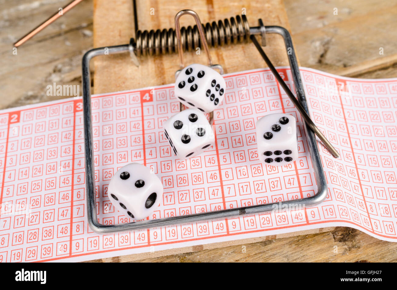 Dice and lottery ticket in a mousetrap, a concept Stock Photo Alamy
