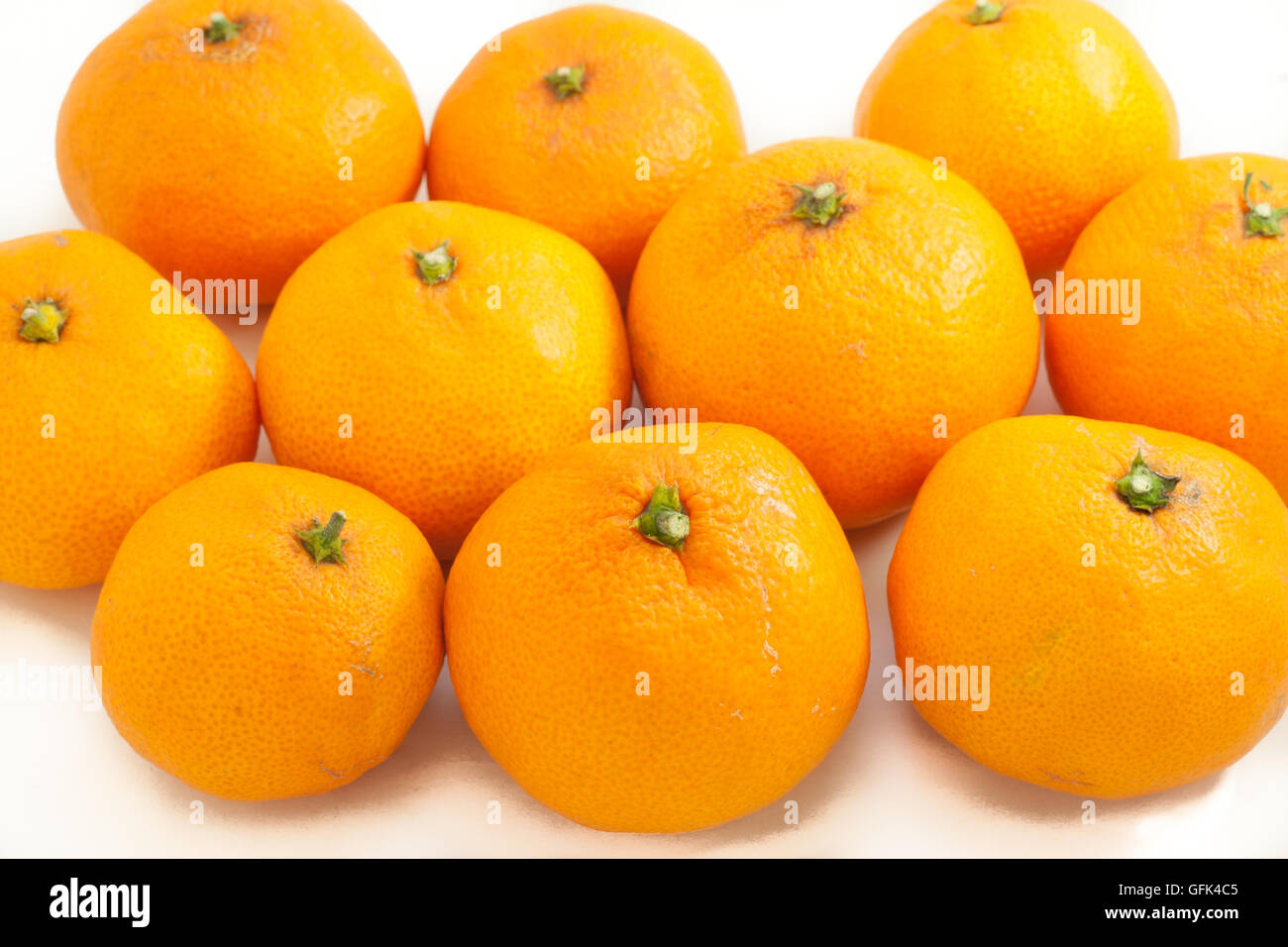 Japanese mandarin orange on white isolated background Stock Photo Alamy