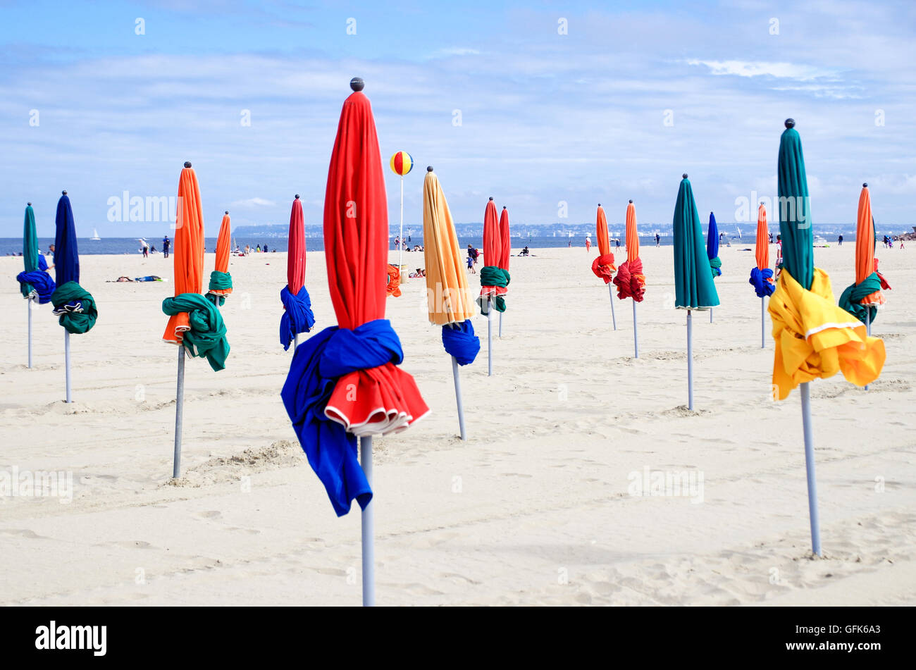View of the plage de Deauville with its colourful beach umbrellas that can be turned into tents on this fine sandy beach Stock Photo