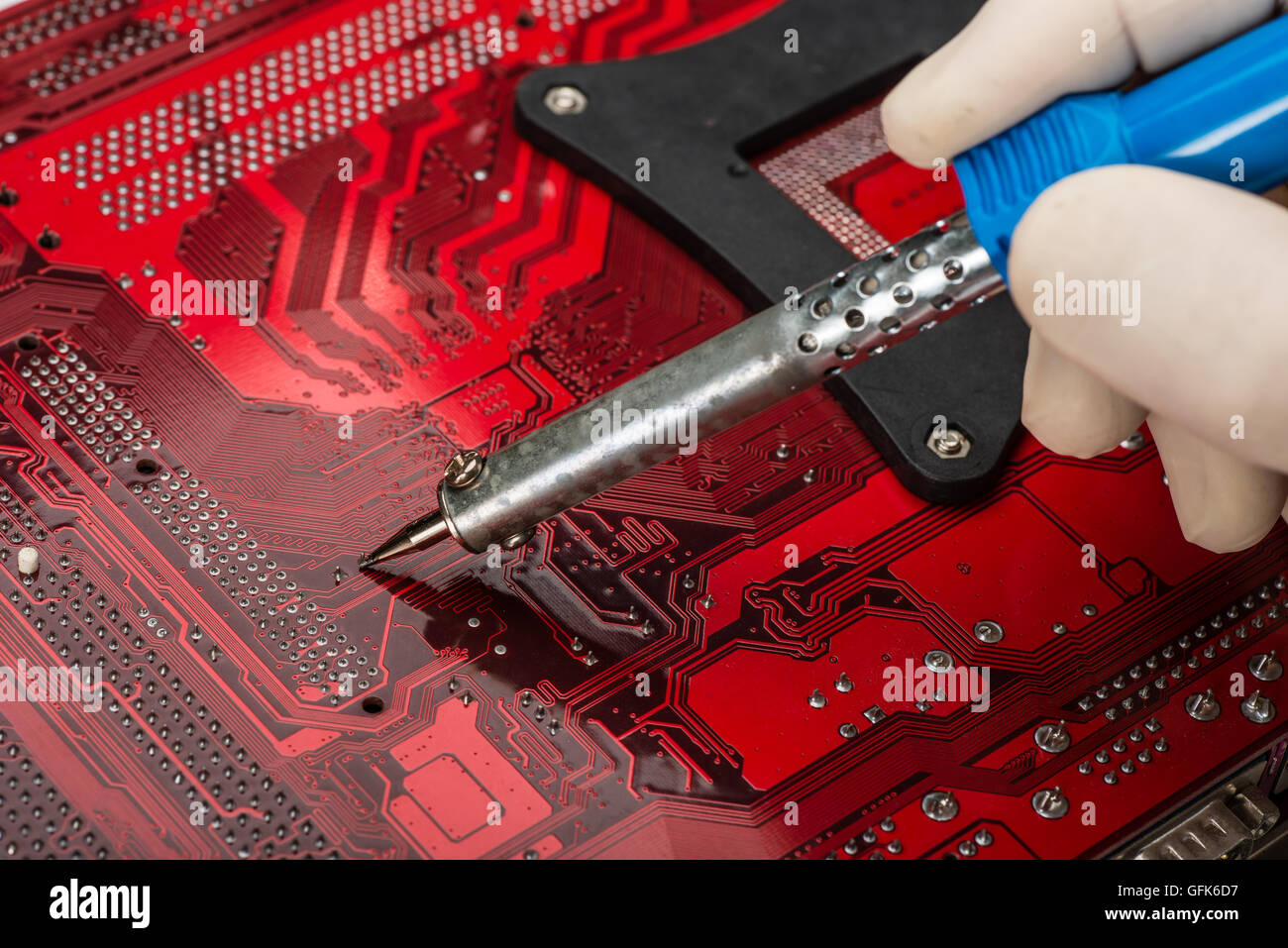 soldering on the main board use soldering iron Stock Photo Alamy