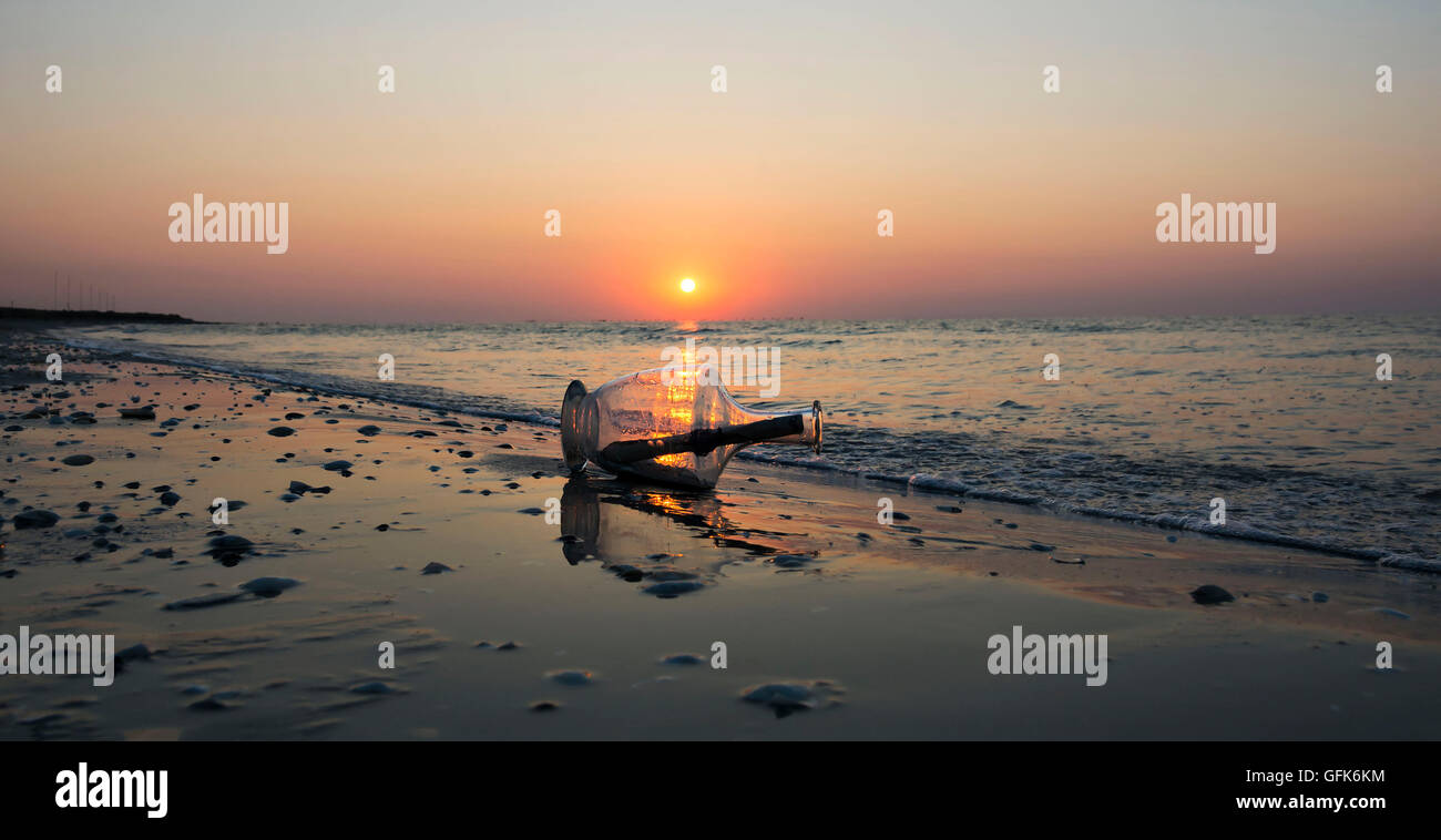Message In A Bottle On Beach At Sunrise Wall Art And Home Stock Photo Alamy