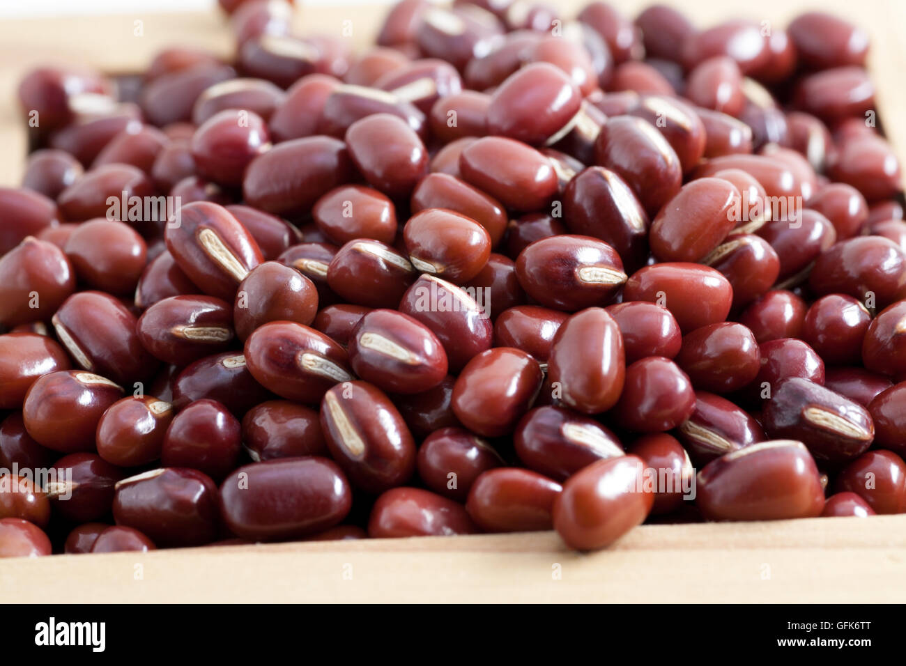 Red beans in Japanese sake cup called Masu in full frame Stock Photo - Alamy