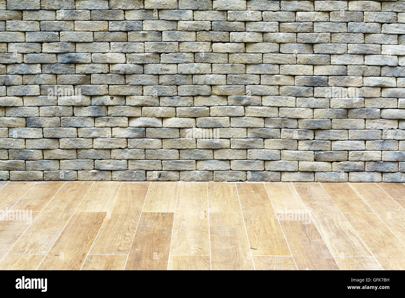 Gray stone brick wall wooden floor room interior background architecture detail Stock Photo