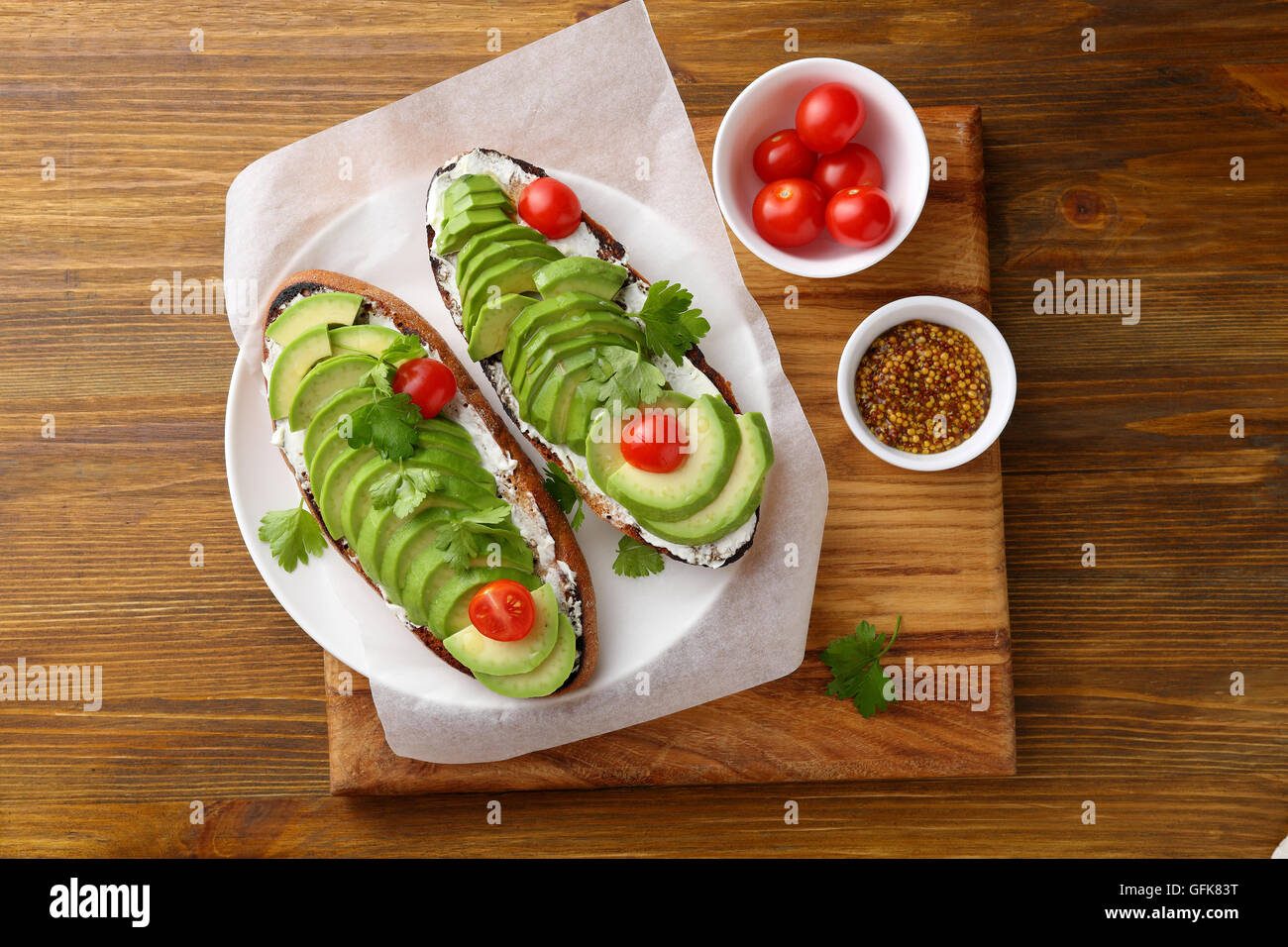 Fresh avocado sandwiches on plate. Food top view Stock Photo