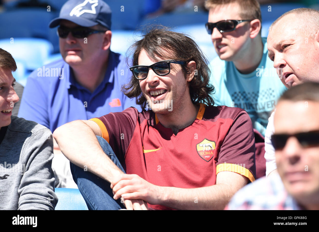 A Roma fan amongst Brighton fans during the Friendly match between Brighton and Hove Albion and Lazio at the American Express Community Stadium in Brighton and Hove. July 31, 2016. Stock Photo