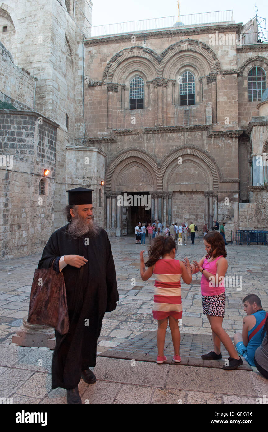 Jerusalem, Old City: people outside the Church of the Holy Sepulchre, containing the believed site where Jesus was crucified and his empty tomb Stock Photo