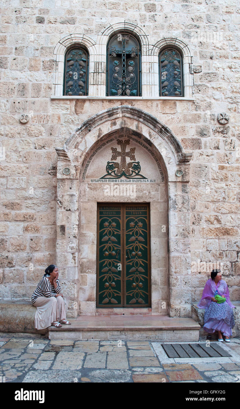 Jerusalem, Old City: women seated outside the Church of the Holy Sepulchre, containing the believed site where Jesus was crucified and his empty tomb Stock Photo