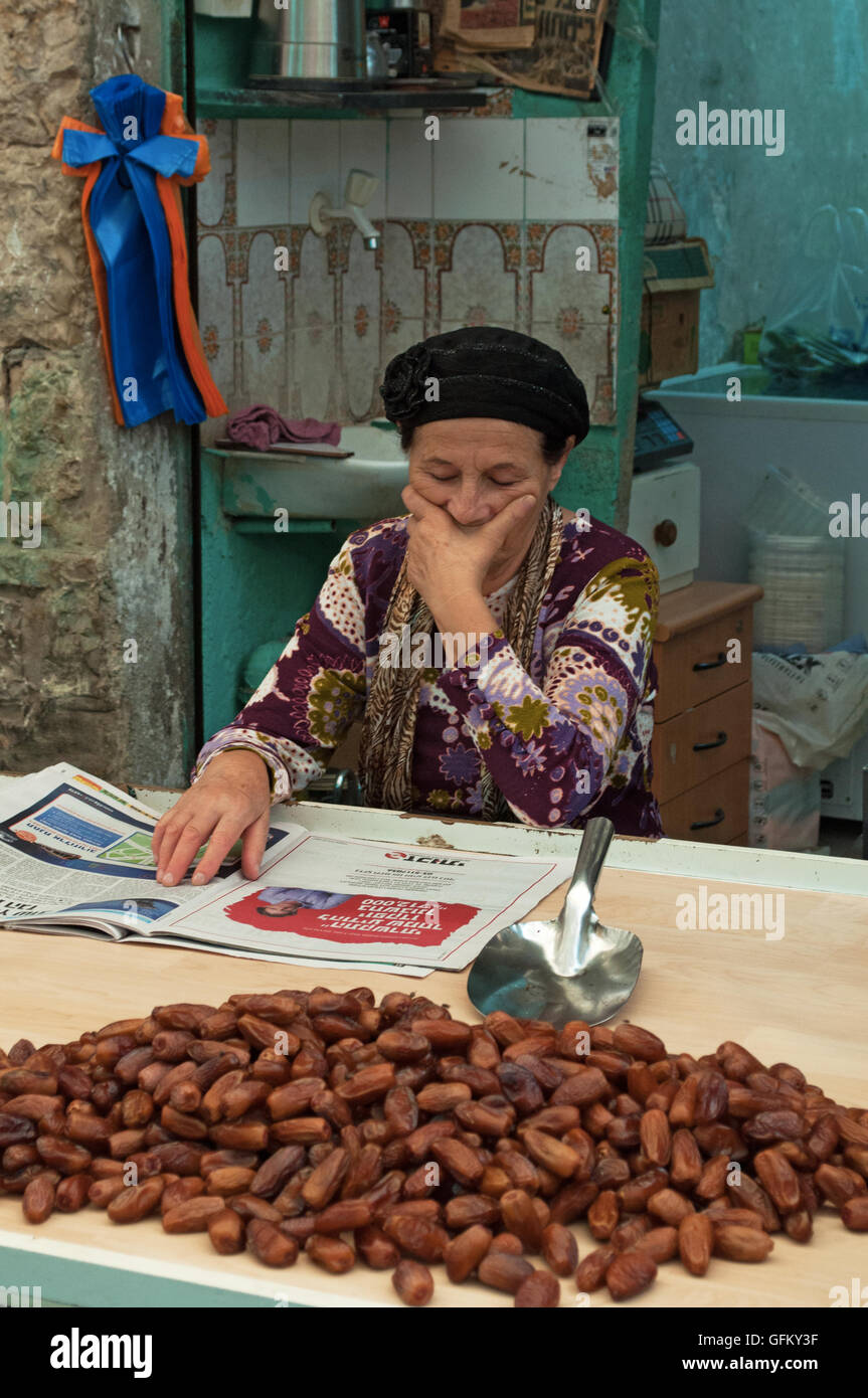 Jerusalem: a seller of dates in Mahane Yehuda Market, called The Shuk is a covered Jewish marketplace with more than 250 vendors Stock Photo