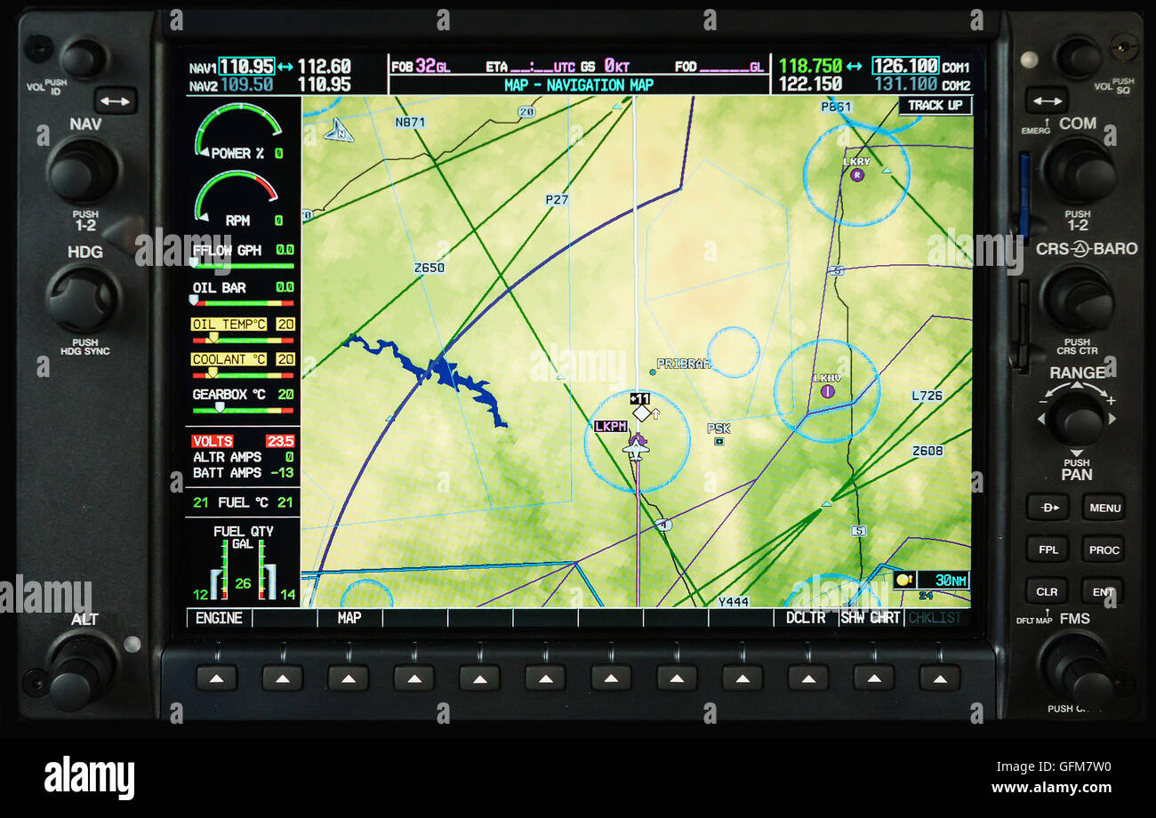 Airplane glass cockpit display G1000 with weather radar and engine gauges  in small private airplane Stock Photo