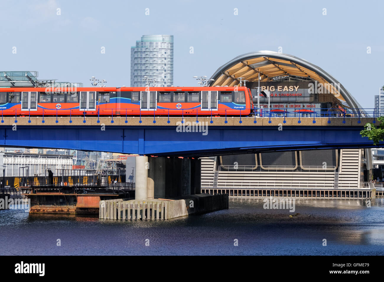 Docklands Light Railway train passing by Crossrail Place in London England United Kingdom UK Stock Photo
