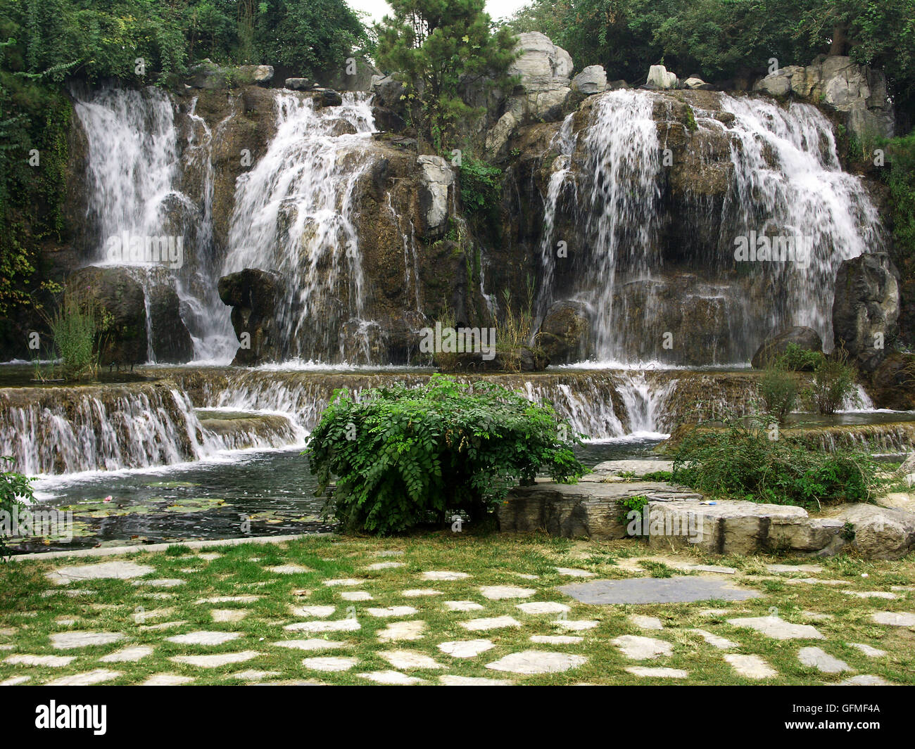 Replica of the Panlong Waterfall at the Chinese Ethnic Culture Park, Beijing – China. Stock Photo