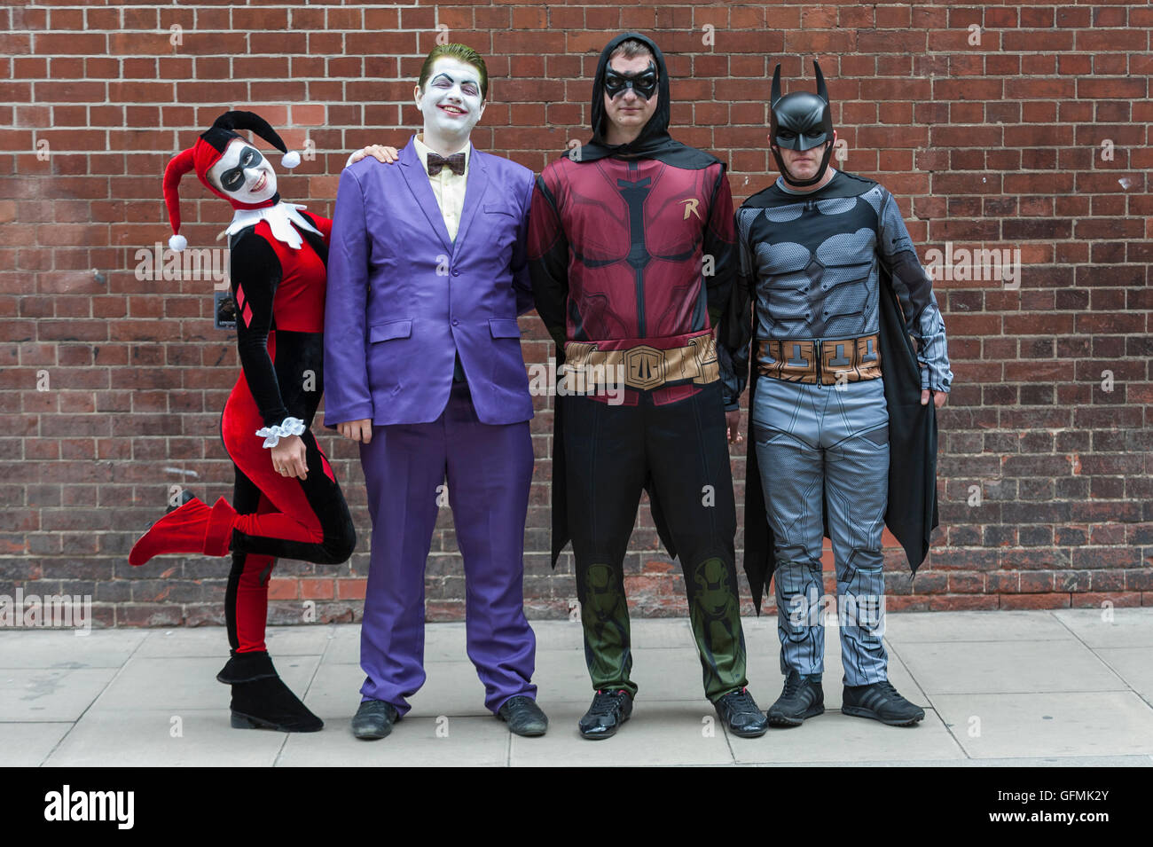 London, UK. 31 July 2016. A group dressed as (L to R) Harley Quin, The Joker,  Robin and Batman join fans in their favourite costumes as they visit London  Film and Comic