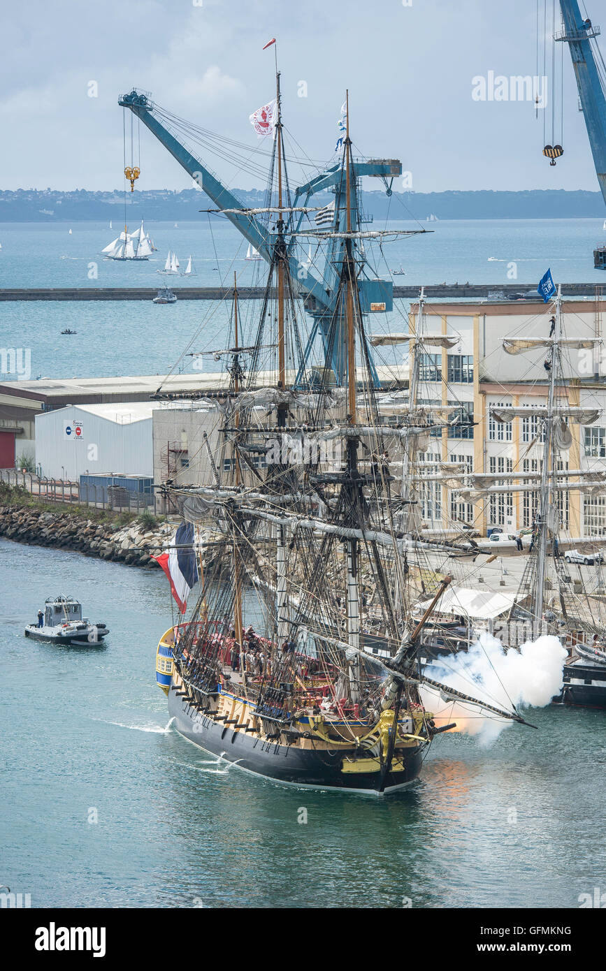 Arriving of the Hermione boat , a replica of the French frigate that transported General Lafayette to America in 1780 to rally US rebels battling for independence, and the castle of Brest, western France, on July 14, 2016, on the first day of the Brest 2016 Maritime feast. Stock Photo